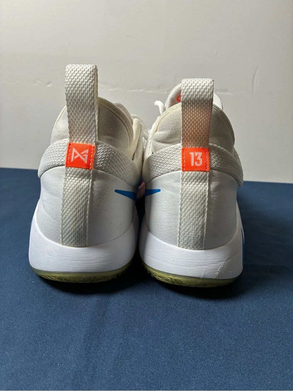 Nike White Youth Athletic Sneakers with Blue & Orange Accents